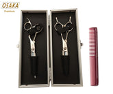 A set of Osaka Premium Japanese Scissors with black handles and silver blades, accompanied by a pair of level-set thinners and a comb, all displayed in a premium scissor case.