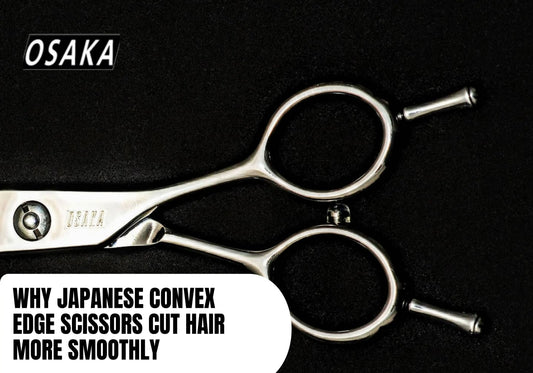 Close-up of Japanese convex edge scissors showing level-set handle design and blade 