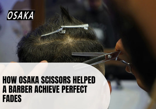 Barber cutting male client's hair with professional equipment at barbershop